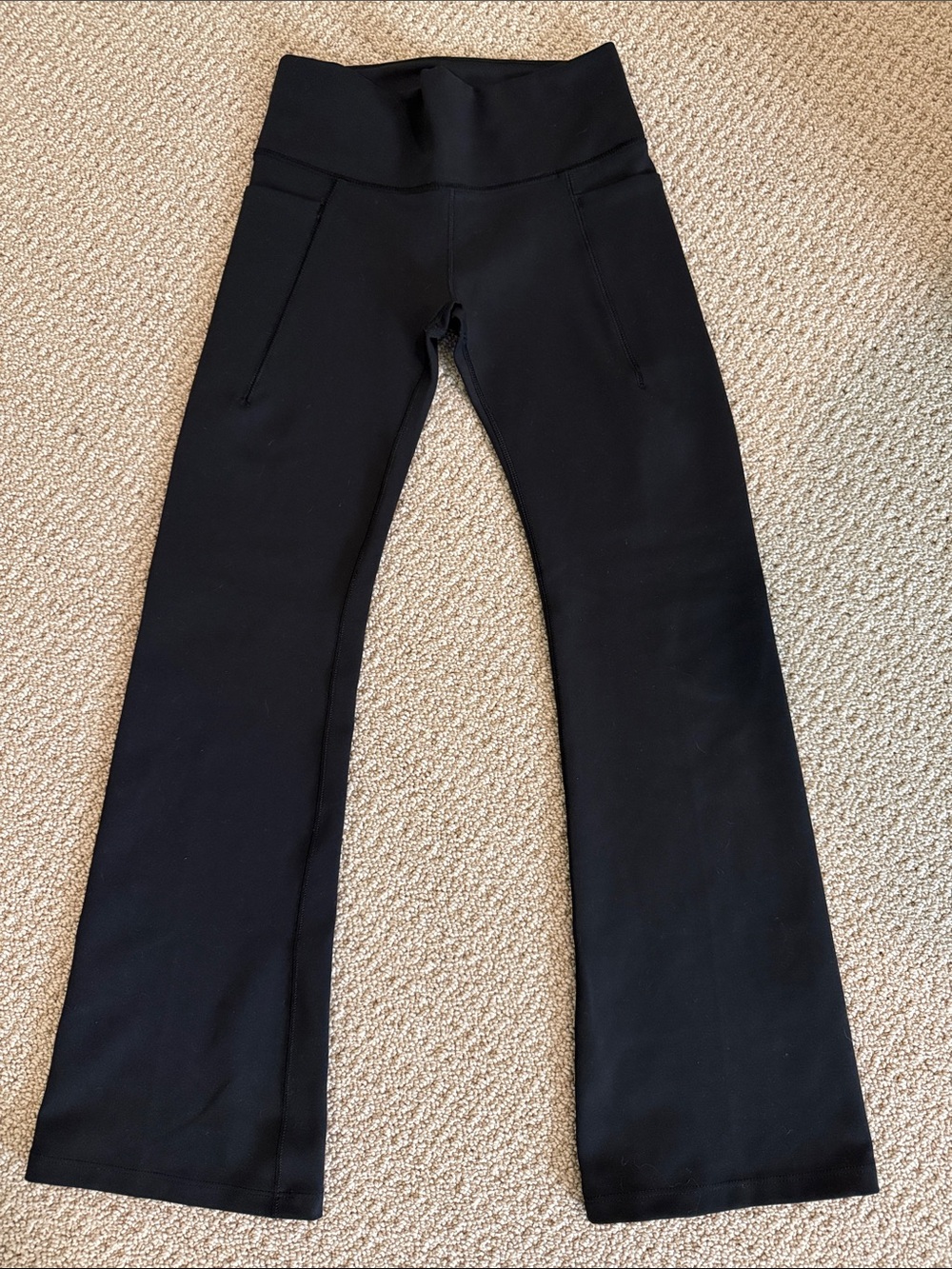 Girls High-Waist Black Flare Leg Active Pants. Small pockets on side.
